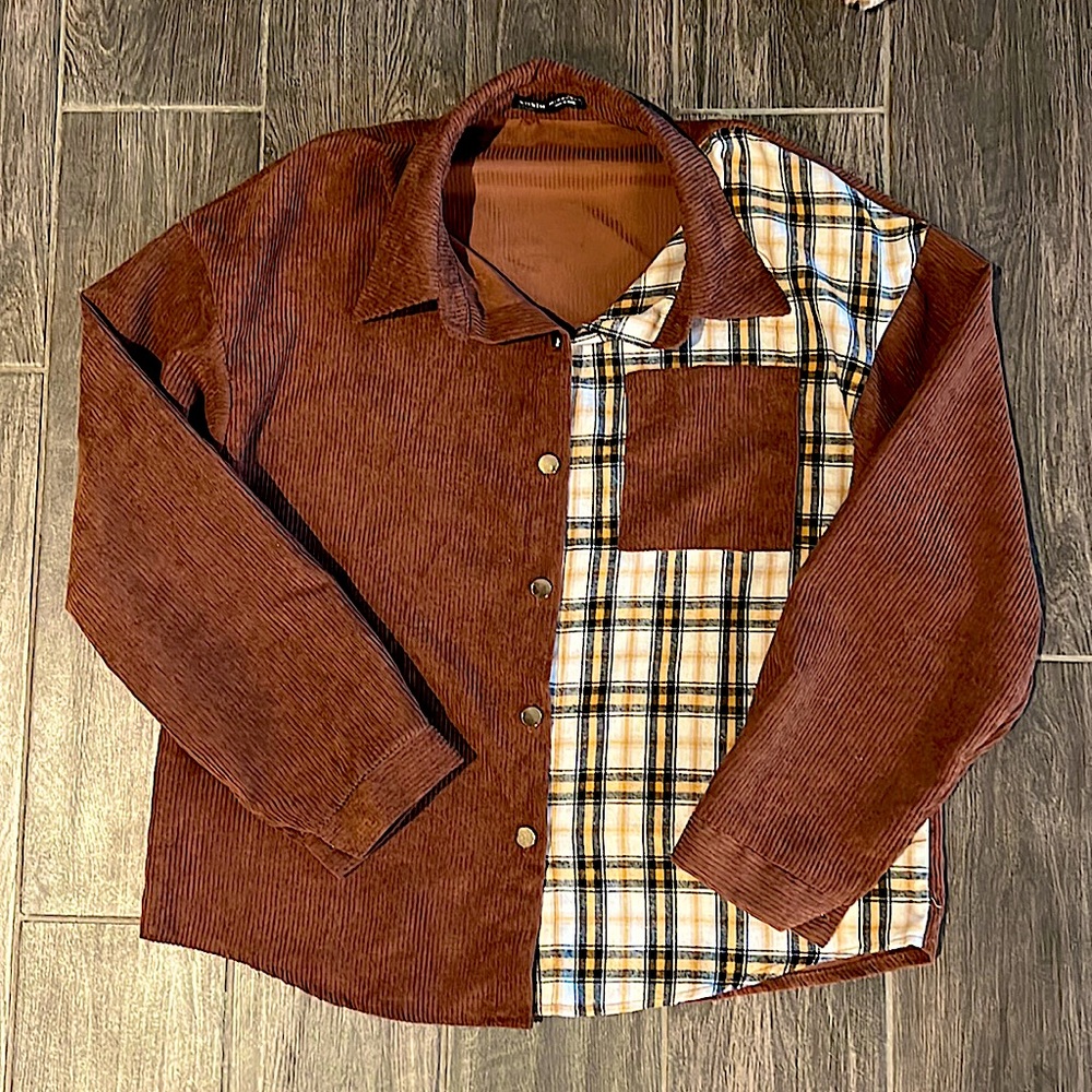 Corduroy, partially flannel jacket. It is thin, so it’s not very warm!